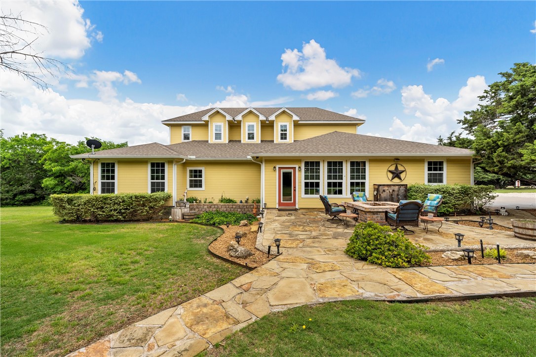 655 Highway 236 Moody, TX 76557 - Photo 30 of 60 a front view of a house with swimming garden and patio