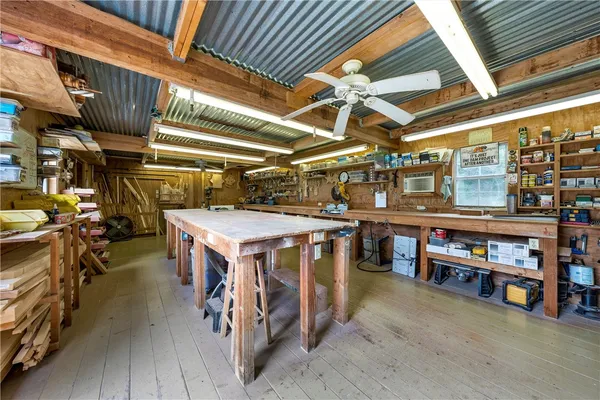 a front view of a house with a yard table and chairs