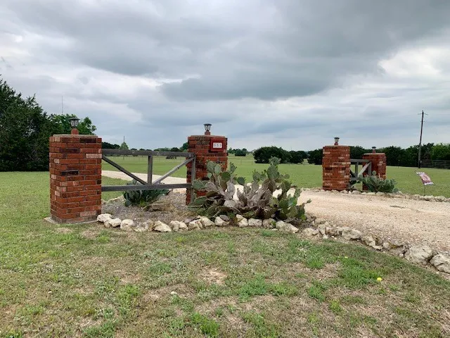 a kitchen with counter top and kitchen view