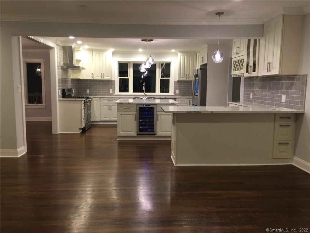 138 Sawmill Road Stamford, CT 06903 - Photo 1 of 1 a large kitchen with lots of counter space and a sink