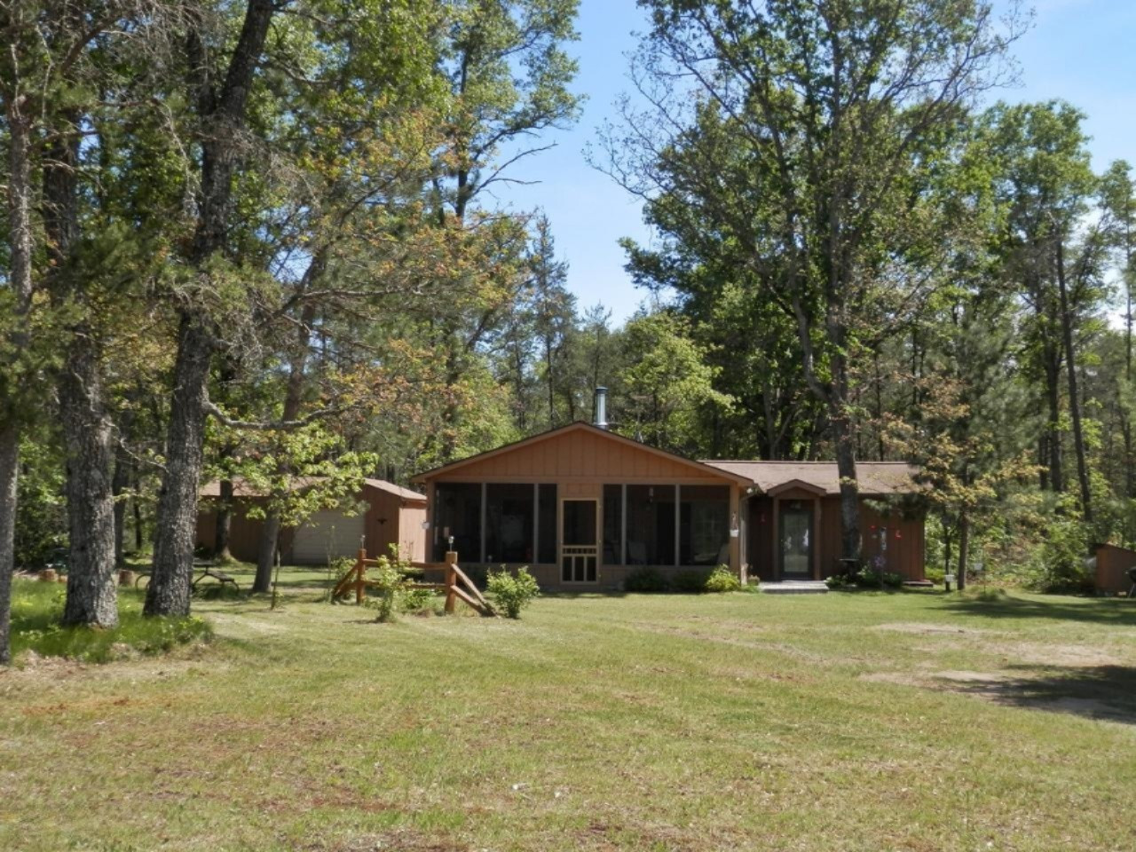 841 11 Mile Road Irons, MI 49644 - Photo 1 of 38 Tucked into over 2 acres of woods
