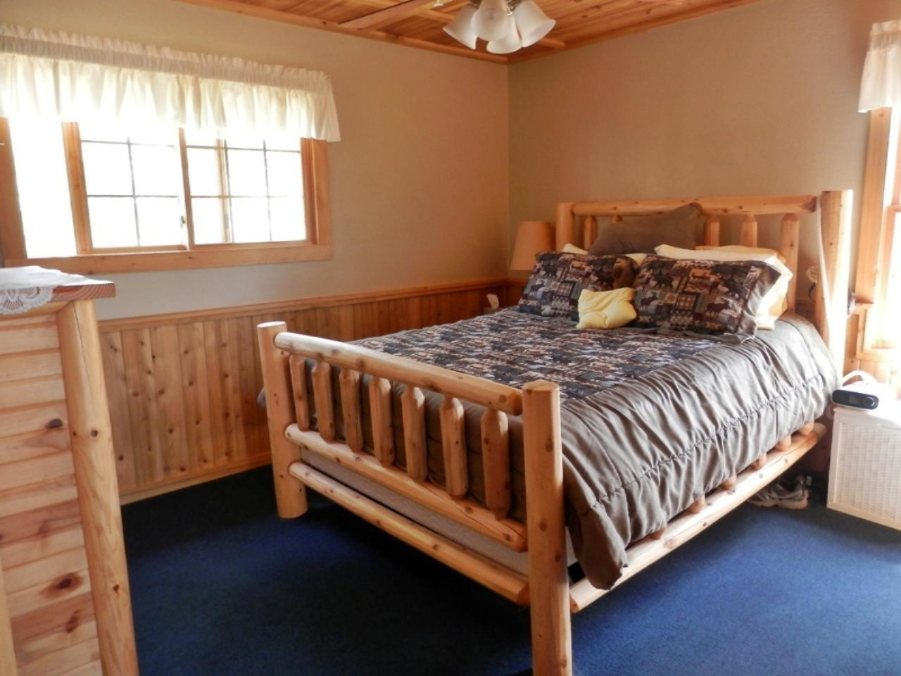 841 11 Mile Road Irons, MI 49644 - Photo 23 of 38 Master bedroom southern exposure window