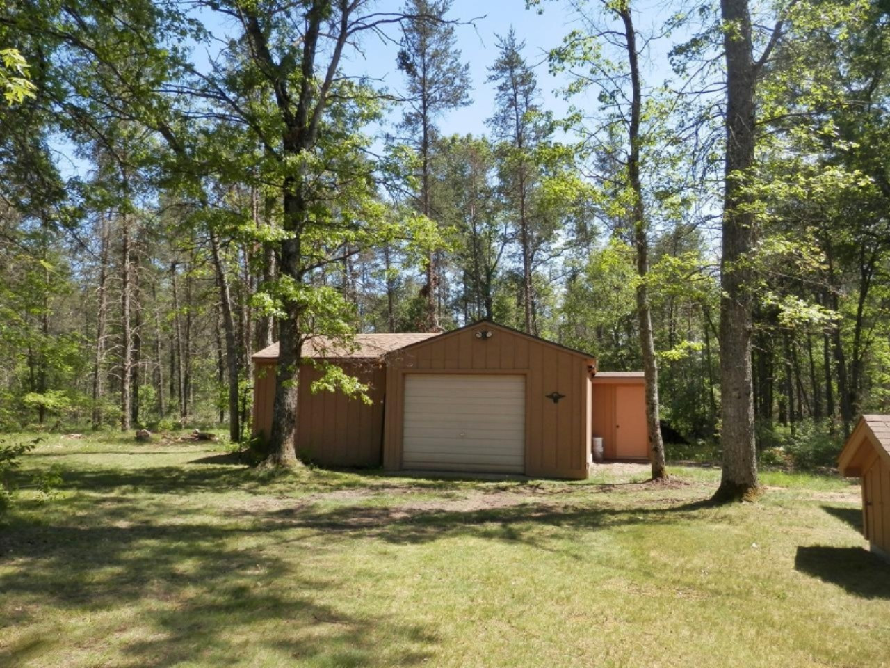 841 11 Mile Road Irons, MI 49644 - Photo 3 of 38 2 car garage with lean to for boat