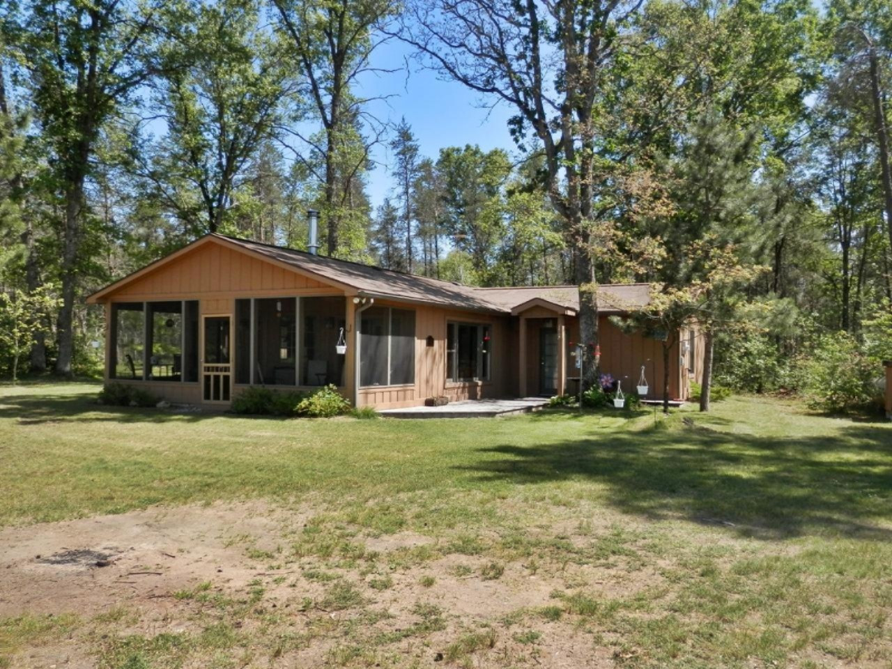 841 11 Mile Road Irons, MI 49644 - Photo 30 of 38 Wonderful screened porch accross front