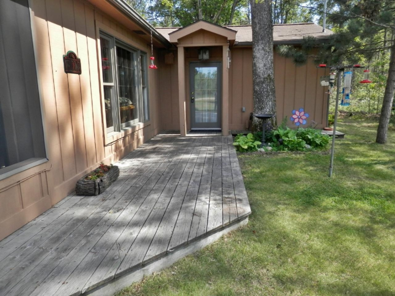 841 11 Mile Road Irons, MI 49644 - Photo 31 of 38 Deck leads to front entrance