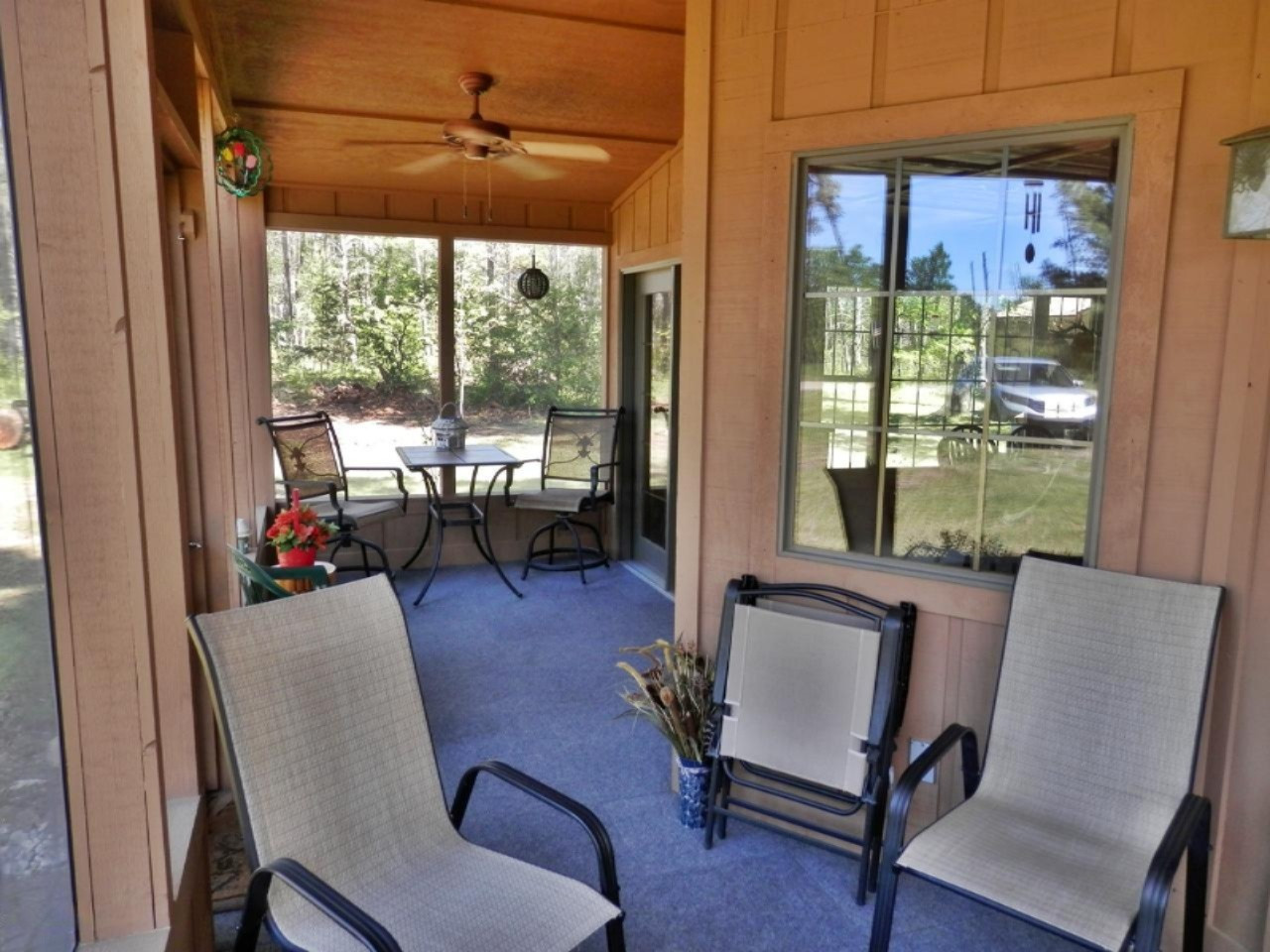841 11 Mile Road Irons, MI 49644 - Photo 4 of 38 Beautiful screened porch across front