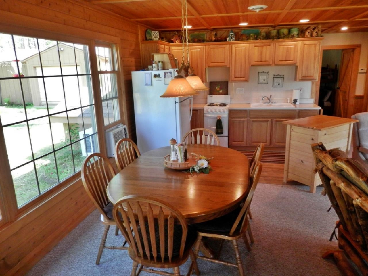 841 11 Mile Road Irons, MI 49644 - Photo 7 of 38 Dining area opens to hickory kitchen