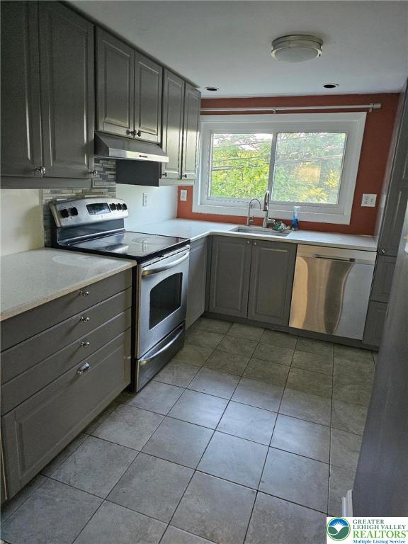 500 Hall Road Nazareth, PA 18064 - Photo 19 of 33 a kitchen with a stove a sink and a microwave