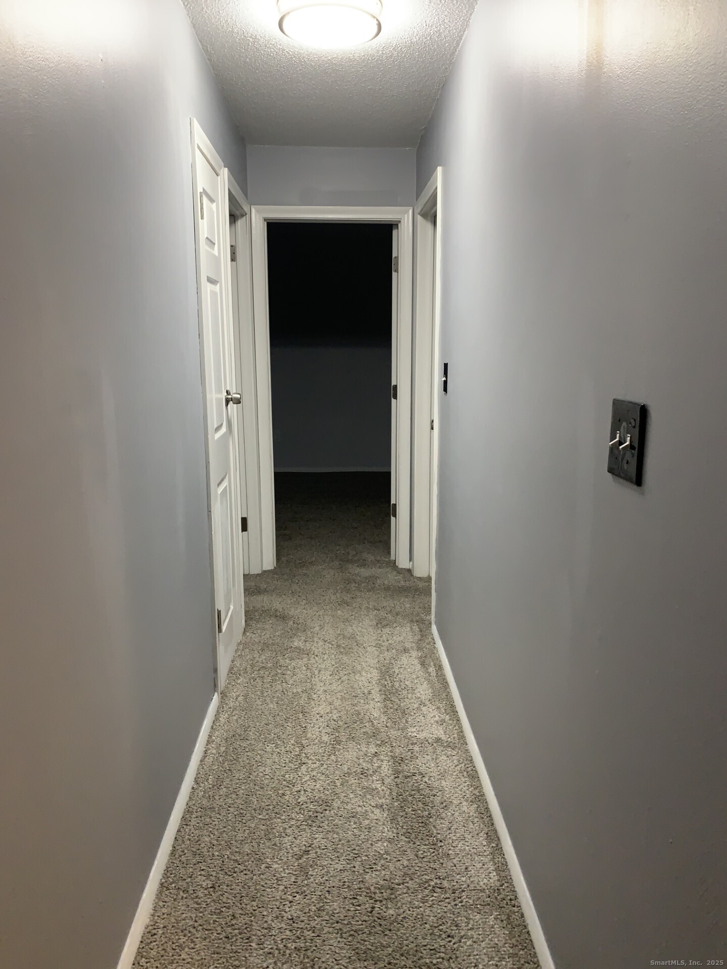 507 Emmett Street, Unit 13 Bristol, CT 06010 - Photo 9 of 16 an entryway door with a hallway in the house