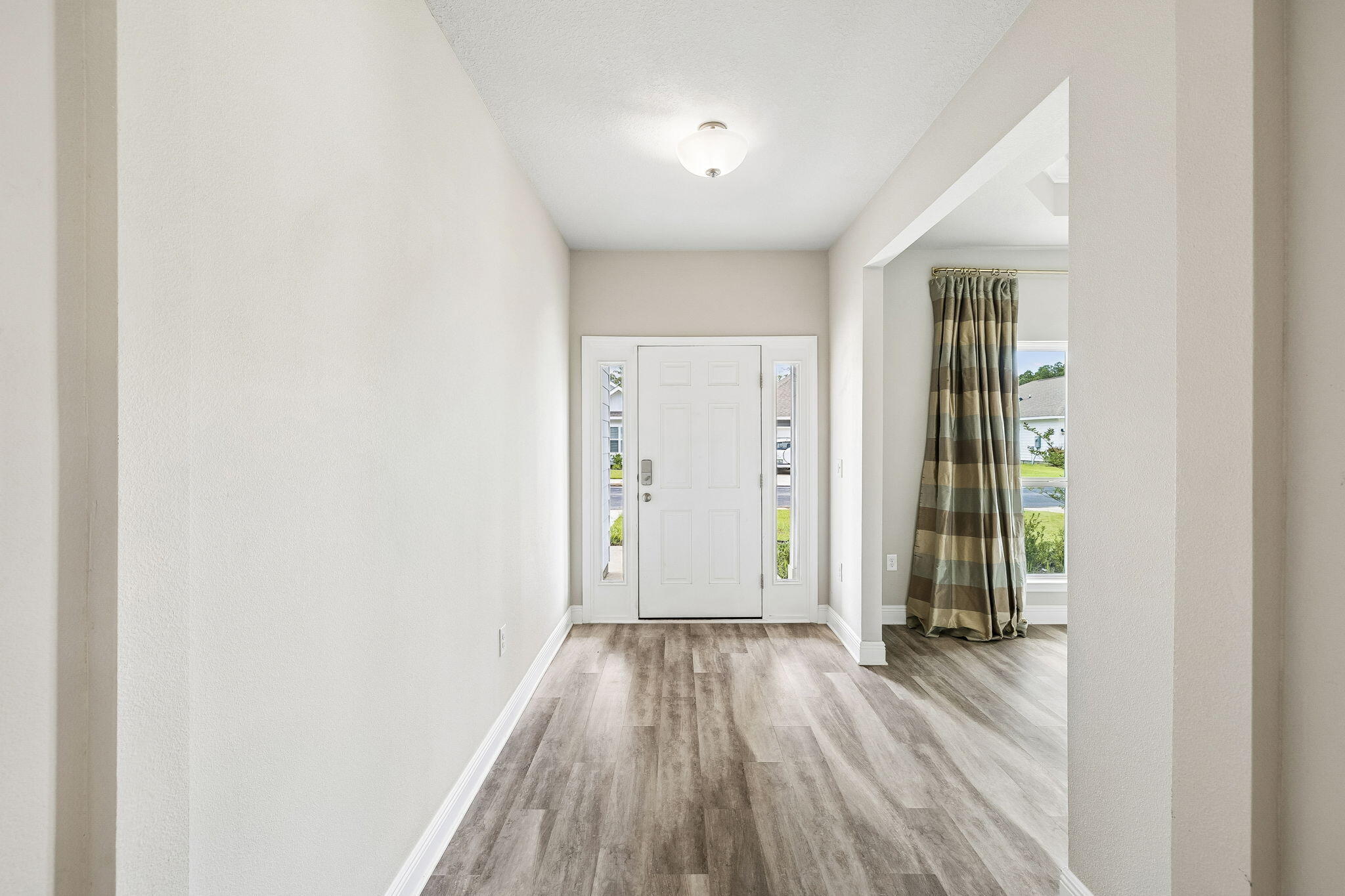 151 Southern Pnes Road, Unit LOT 10 Santa Rosa Beach, FL 32459 - Photo 4 of 35 Entry hall off front room