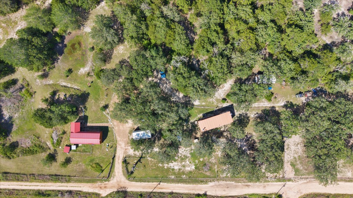 1705 Makinson Road West Point, TX 78963 - Photo 31 of 40 An aerial perspective reveals the expansive, tree-dotted grounds of this private property.