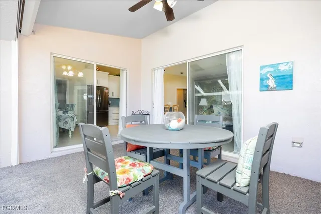 a view of a dining room with furniture and window