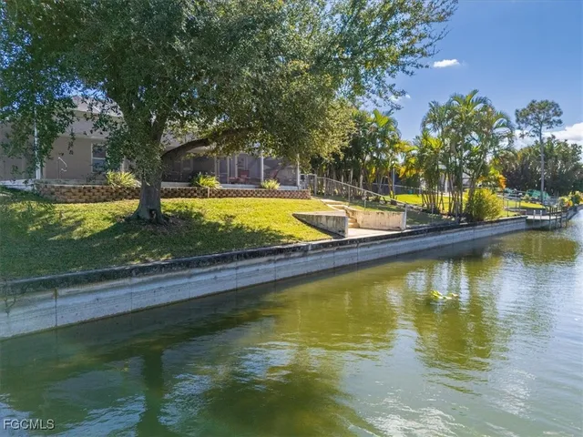 a view of a swimming pool with an outdoor space and seating area
