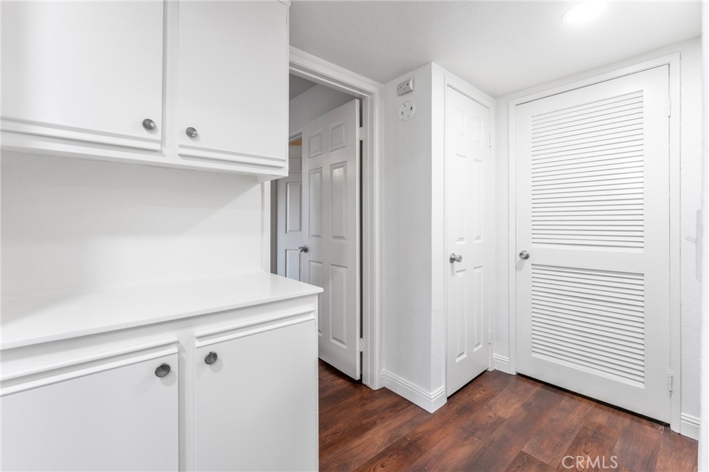34264 Camino Capistrano, Unit 102 Dana Point, CA 92624 - Photo 15 of 37 a view white cabinets and wooden floor