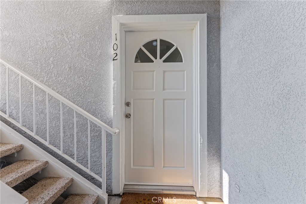34264 Camino Capistrano, Unit 102 Dana Point, CA 92624 - Photo 2 of 37 a view of entryway with wooden floor