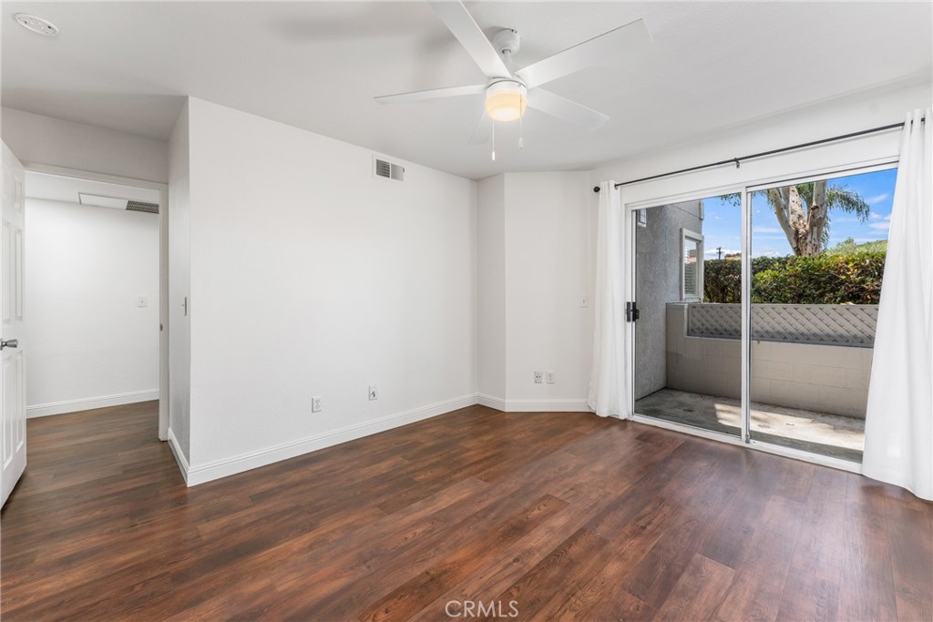 34264 Camino Capistrano, Unit 102 Dana Point, CA 92624 - Photo 24 of 37 wooden floor in an empty room with a window