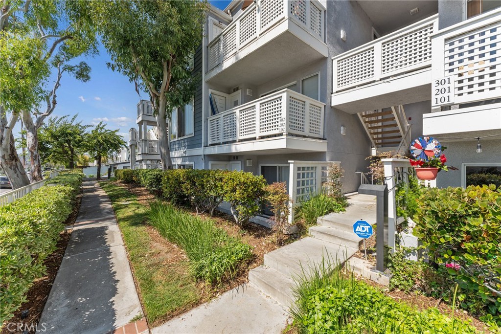 34264 Camino Capistrano, Unit 102 Dana Point, CA 92624 - Photo 27 of 37 a view of a house with a yard and garden