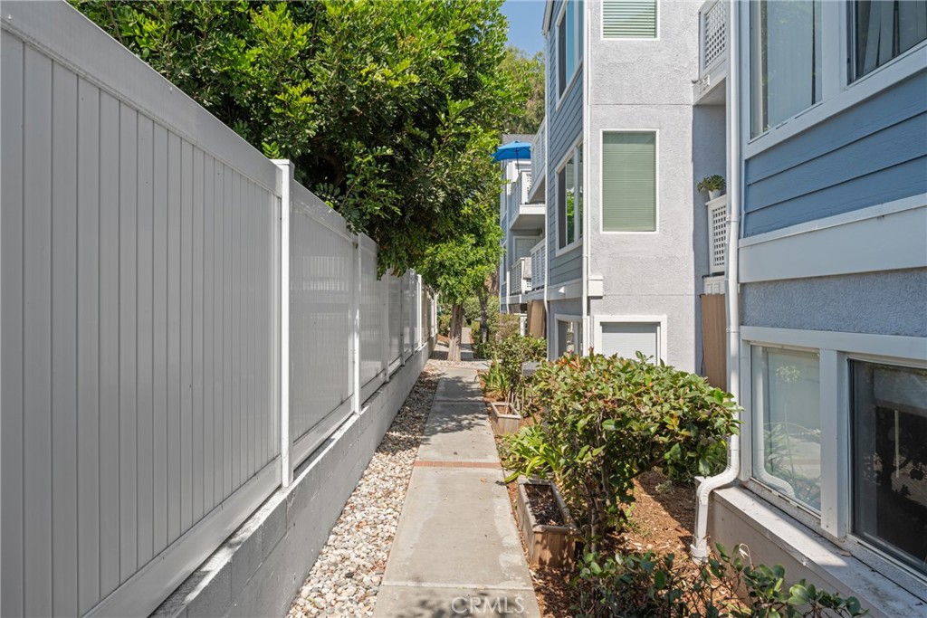 34264 Camino Capistrano, Unit 102 Dana Point, CA 92624 - Photo 28 of 37 a house with trees in front of it