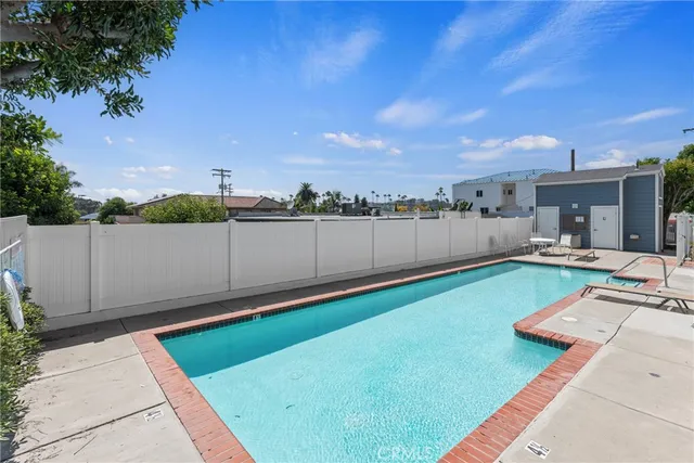 an outdoor space with pool and furniture