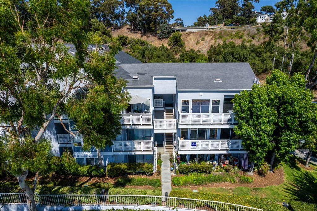 34264 Camino Capistrano, Unit 102 Dana Point, CA 92624 - Photo 32 of 37 front view of house with a yard