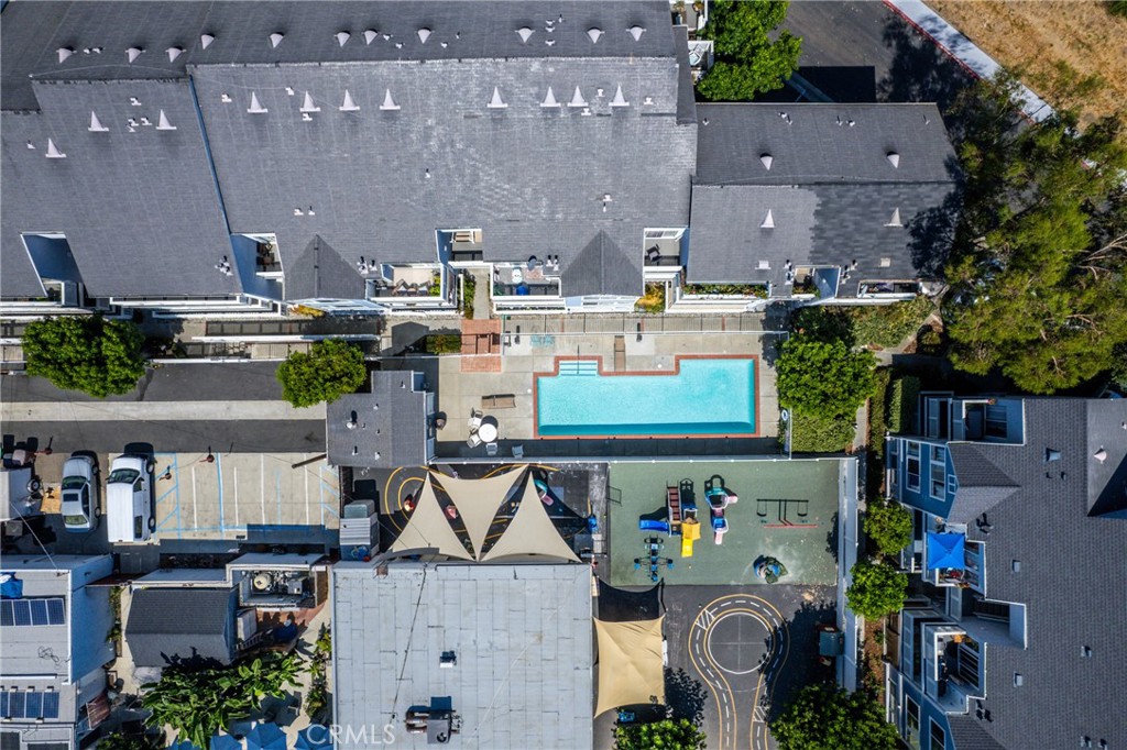 34264 Camino Capistrano, Unit 102 Dana Point, CA 92624 - Photo 33 of 37 an aerial view of multiple houses with a yard