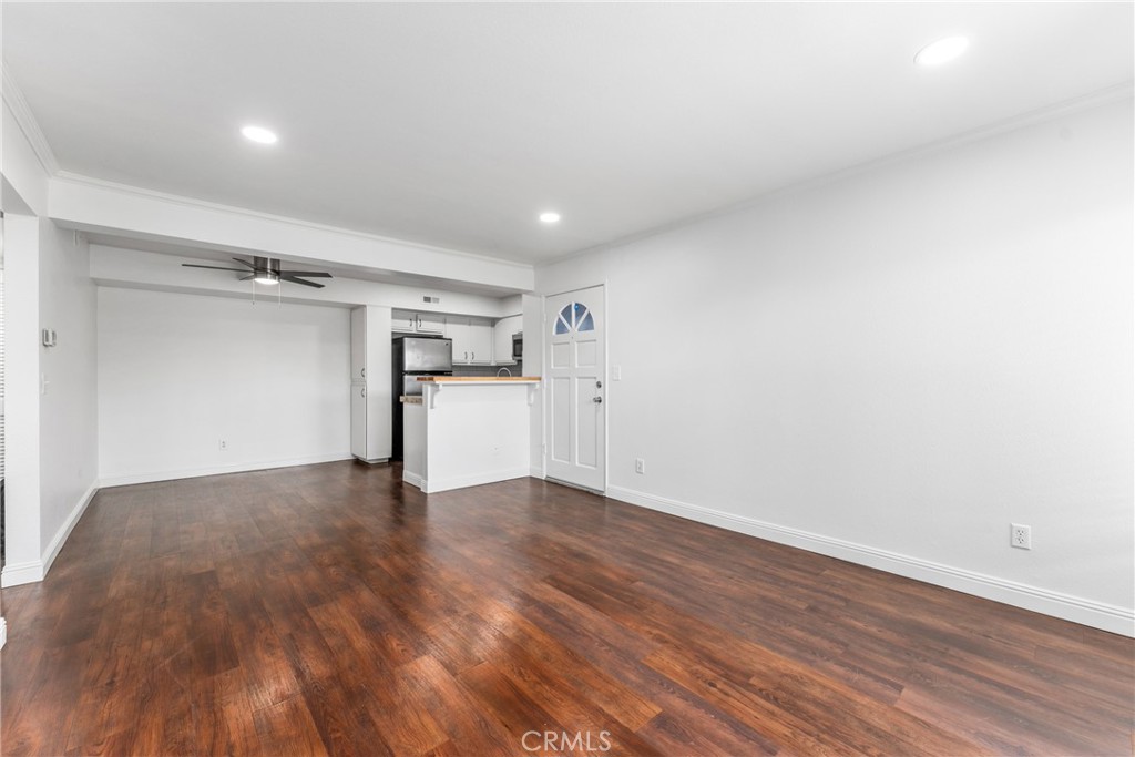 34264 Camino Capistrano, Unit 102 Dana Point, CA 92624 - Photo 4 of 37 a view of empty room with wooden floor