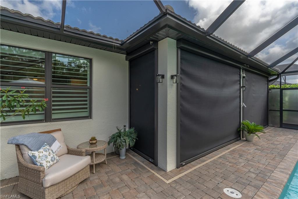 6848 Winding Cypress Drive Naples, FL 34114 - Photo 16 of 47 a backyard of a house with potted plants