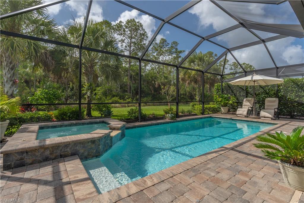 6848 Winding Cypress Drive Naples, FL 34114 - Photo 2 of 47 a view of a backyard