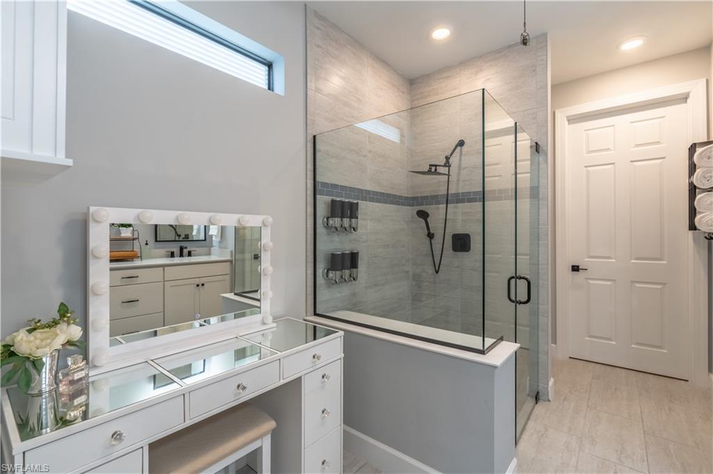 6848 Winding Cypress Drive Naples, FL 34114 - Photo 22 of 47 a bathroom with a shower and a sink