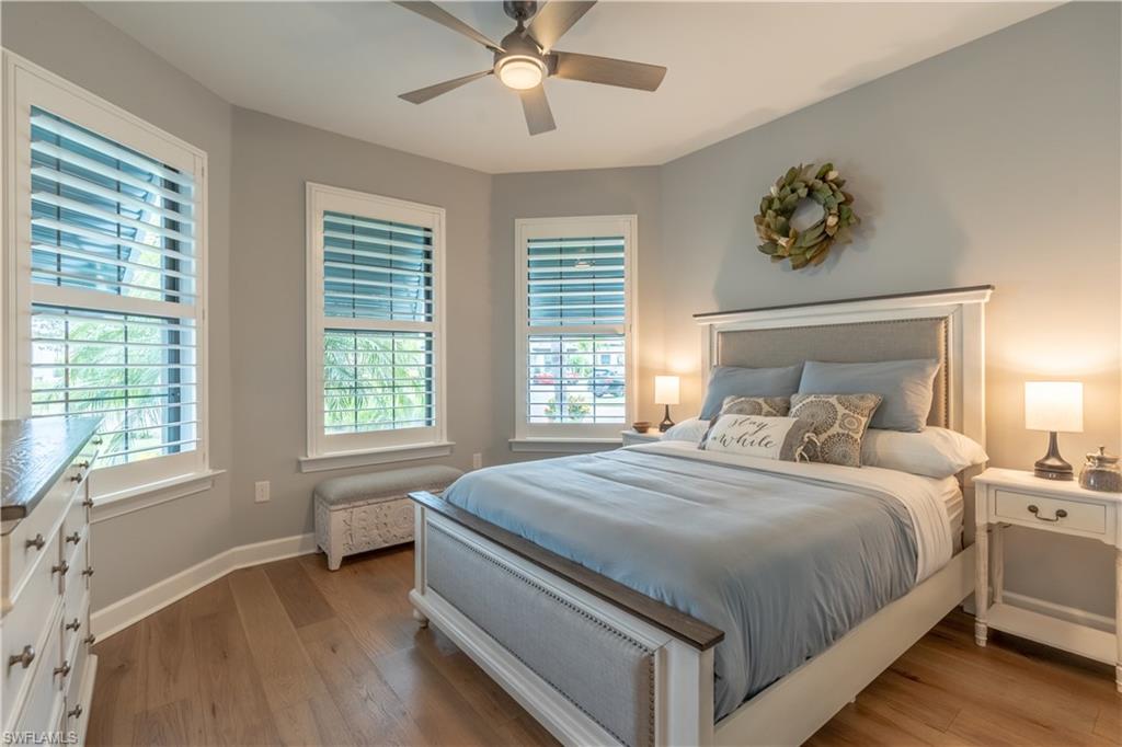 6848 Winding Cypress Drive Naples, FL 34114 - Photo 29 of 47 a bedroom with a large bed and a window