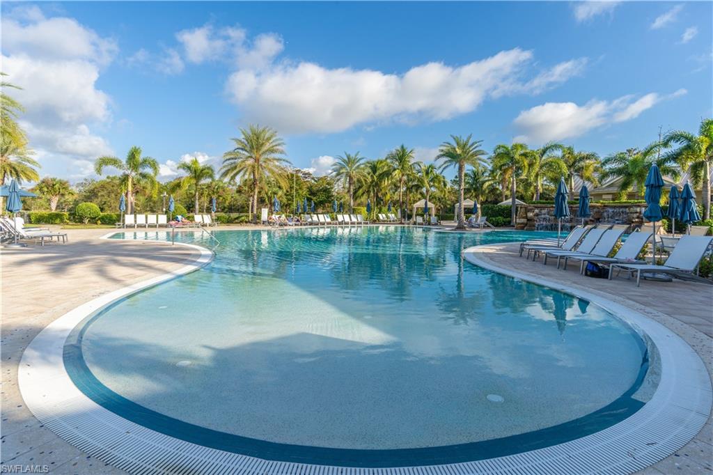 6848 Winding Cypress Drive Naples, FL 34114 - Photo 42 of 47 a view of a lake with a house