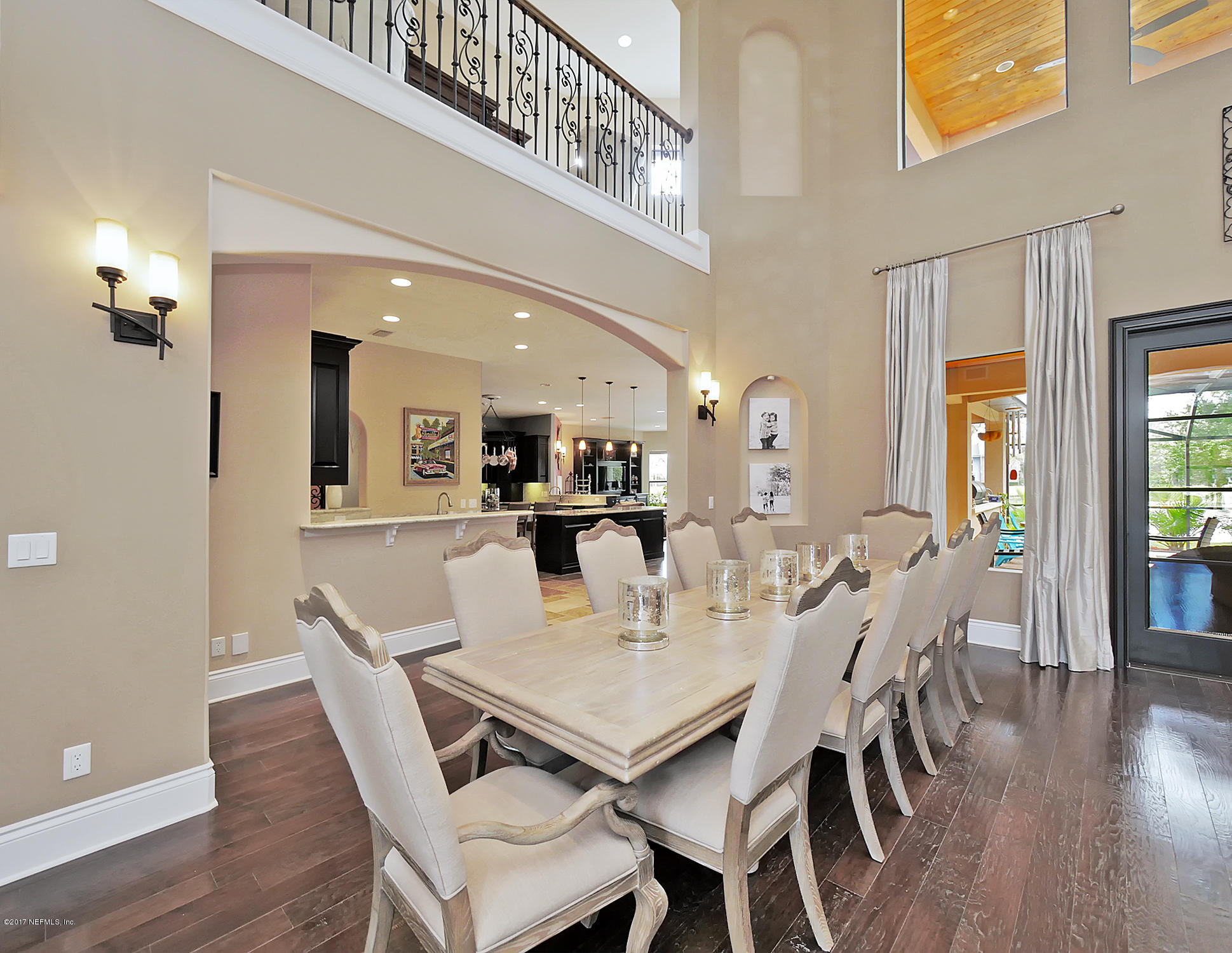 8074 Green Glade Road Jacksonville, FL 32256 - Photo 12 of 71 a view of a dining room with furniture and wooden floor