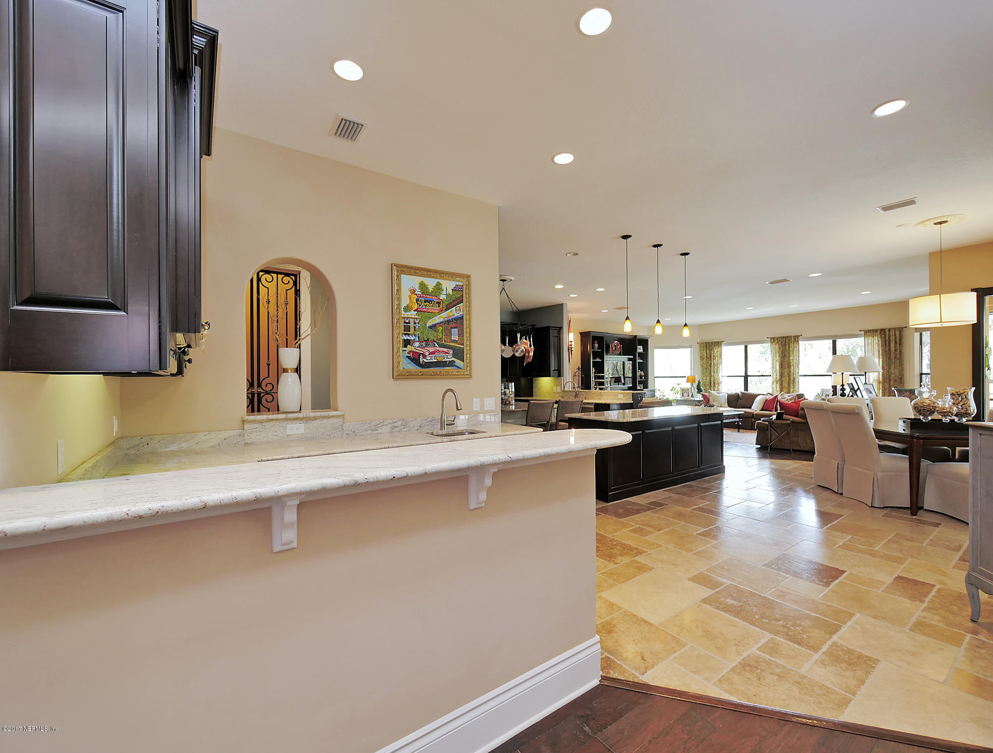 8074 Green Glade Road Jacksonville, FL 32256 - Photo 13 of 71 a large kitchen with stainless steel appliances a large counter top a stove and a sink