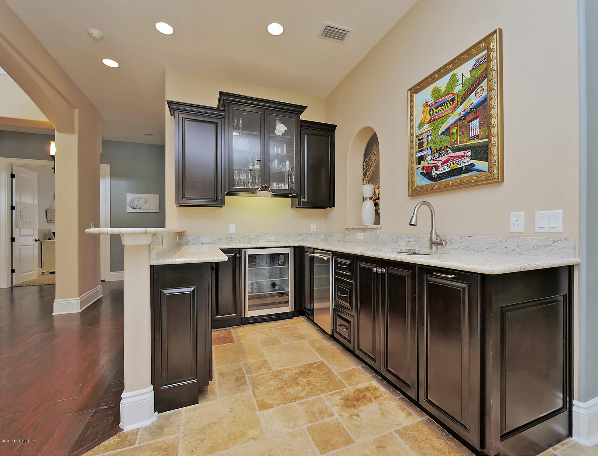 8074 Green Glade Road Jacksonville, FL 32256 - Photo 14 of 71 a kitchen with stainless steel appliances kitchen island granite countertop a refrigerator and a sink