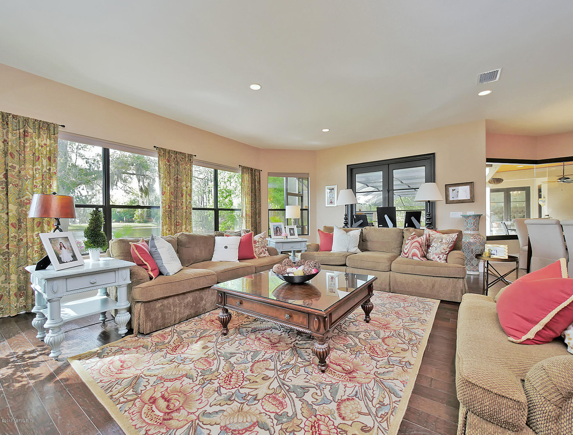 8074 Green Glade Road Jacksonville, FL 32256 - Photo 26 of 71 a living room with furniture and a rug