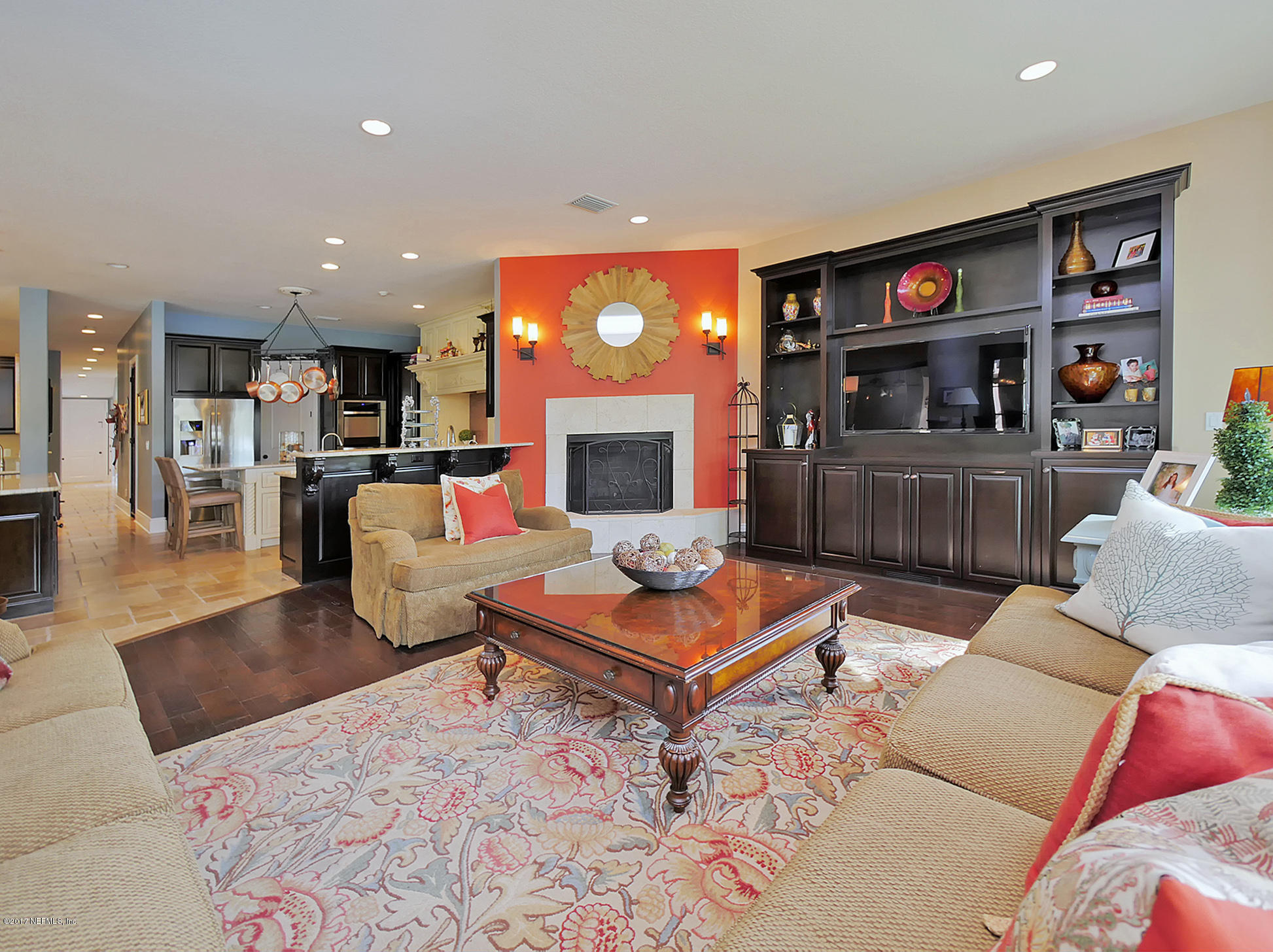 8074 Green Glade Road Jacksonville, FL 32256 - Photo 27 of 71 a living room with furniture and a fireplace