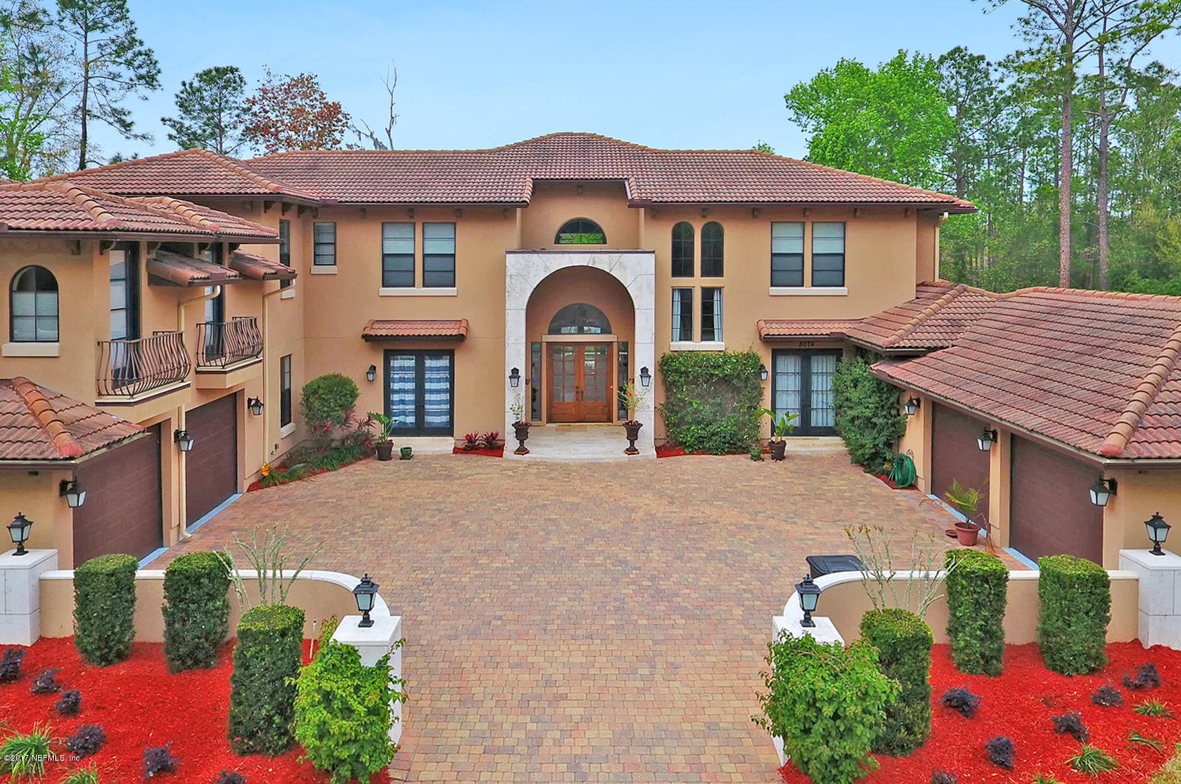 8074 Green Glade Road Jacksonville, FL 32256 - Photo 3 of 71 a front view of a house with a yard and garage