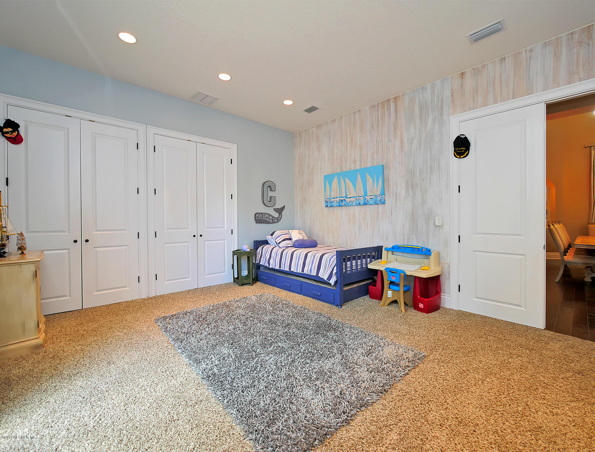 8074 Green Glade Road Jacksonville, FL 32256 - Photo 37 of 71 a bedroom with furniture and a dresser