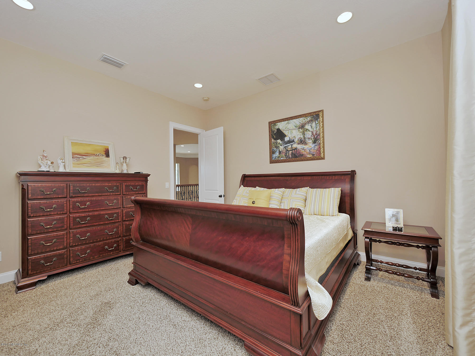 8074 Green Glade Road Jacksonville, FL 32256 - Photo 49 of 71 a bed room with a bed and a chair