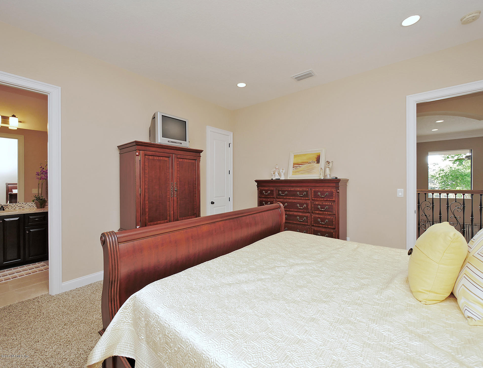 8074 Green Glade Road Jacksonville, FL 32256 - Photo 50 of 71 a bedroom with a bed and dresser