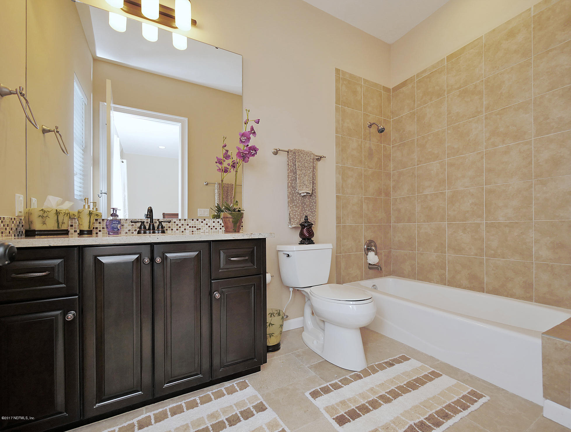 8074 Green Glade Road Jacksonville, FL 32256 - Photo 51 of 71 a bathroom with a sink a toilet and shower