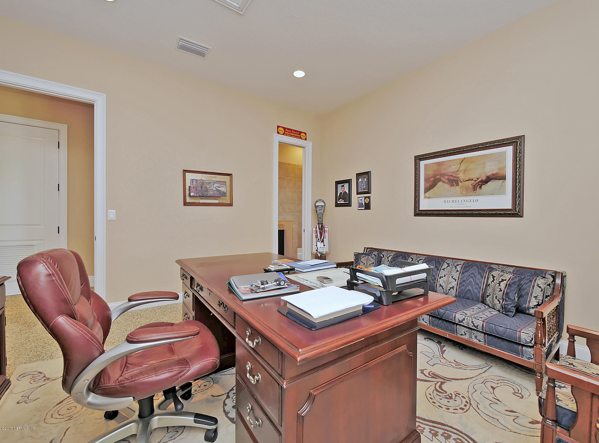 8074 Green Glade Road Jacksonville, FL 32256 - Photo 53 of 71 a living room with furniture and a couch