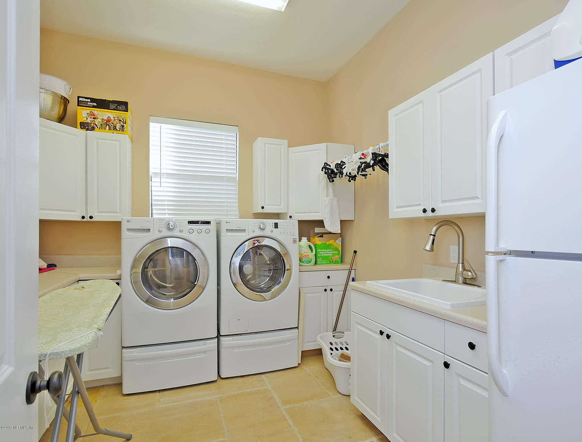 8074 Green Glade Road Jacksonville, FL 32256 - Photo 55 of 71 a utility room with sink dryer and washer