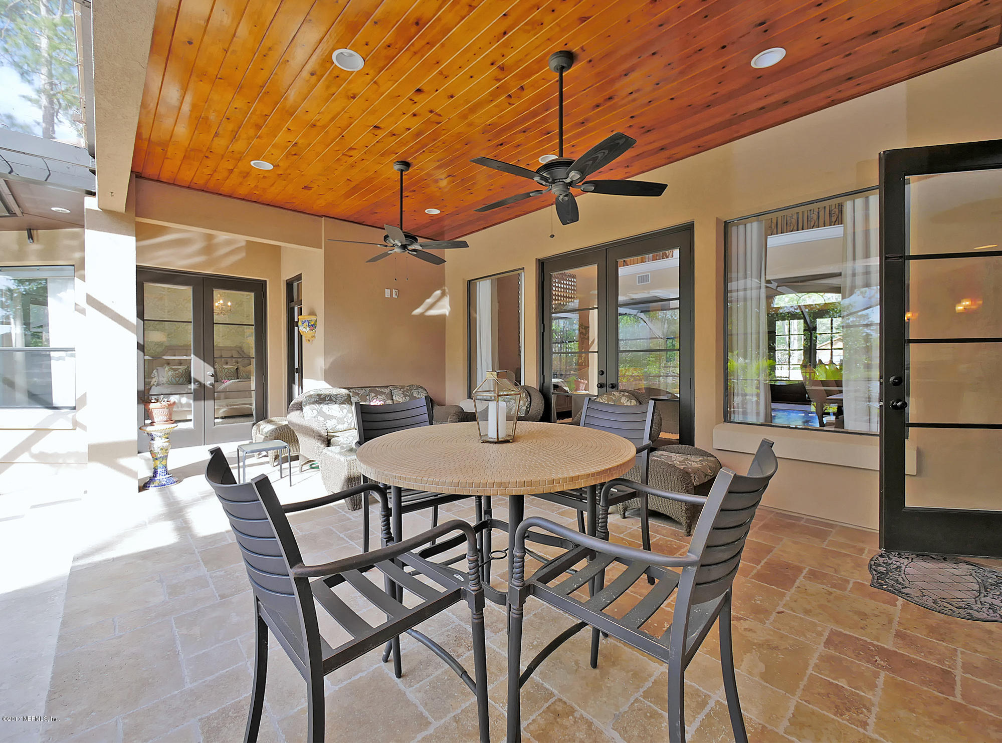 8074 Green Glade Road Jacksonville, FL 32256 - Photo 58 of 71 a view of a dining room and livingroom with furniture wooden floor a chandelier