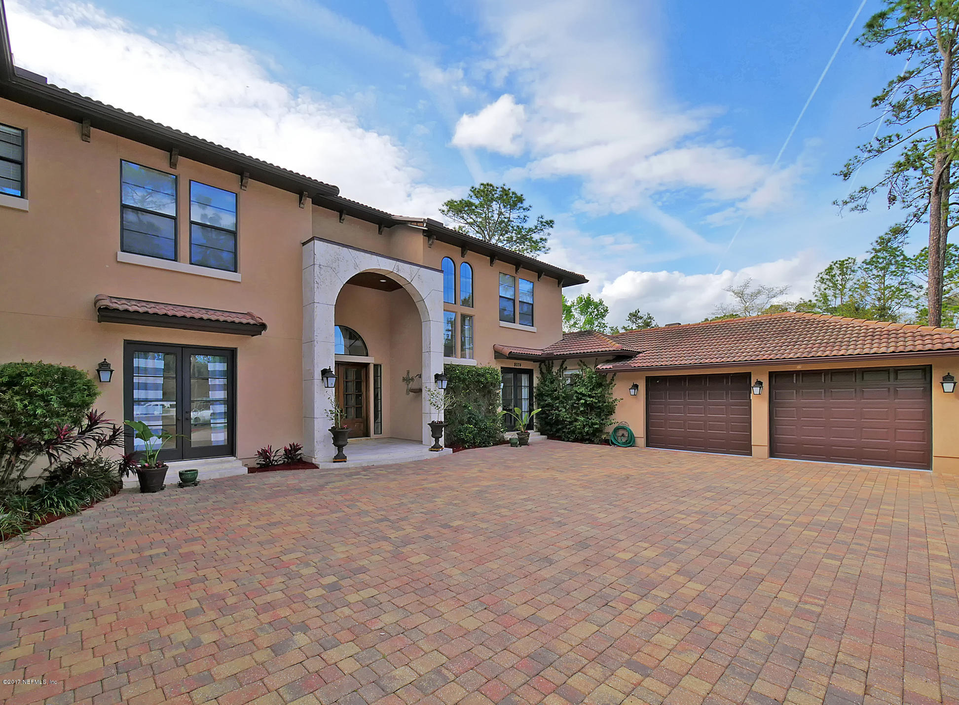 8074 Green Glade Road Jacksonville, FL 32256 - Photo 6 of 71 a front view of a house with a yard and garage