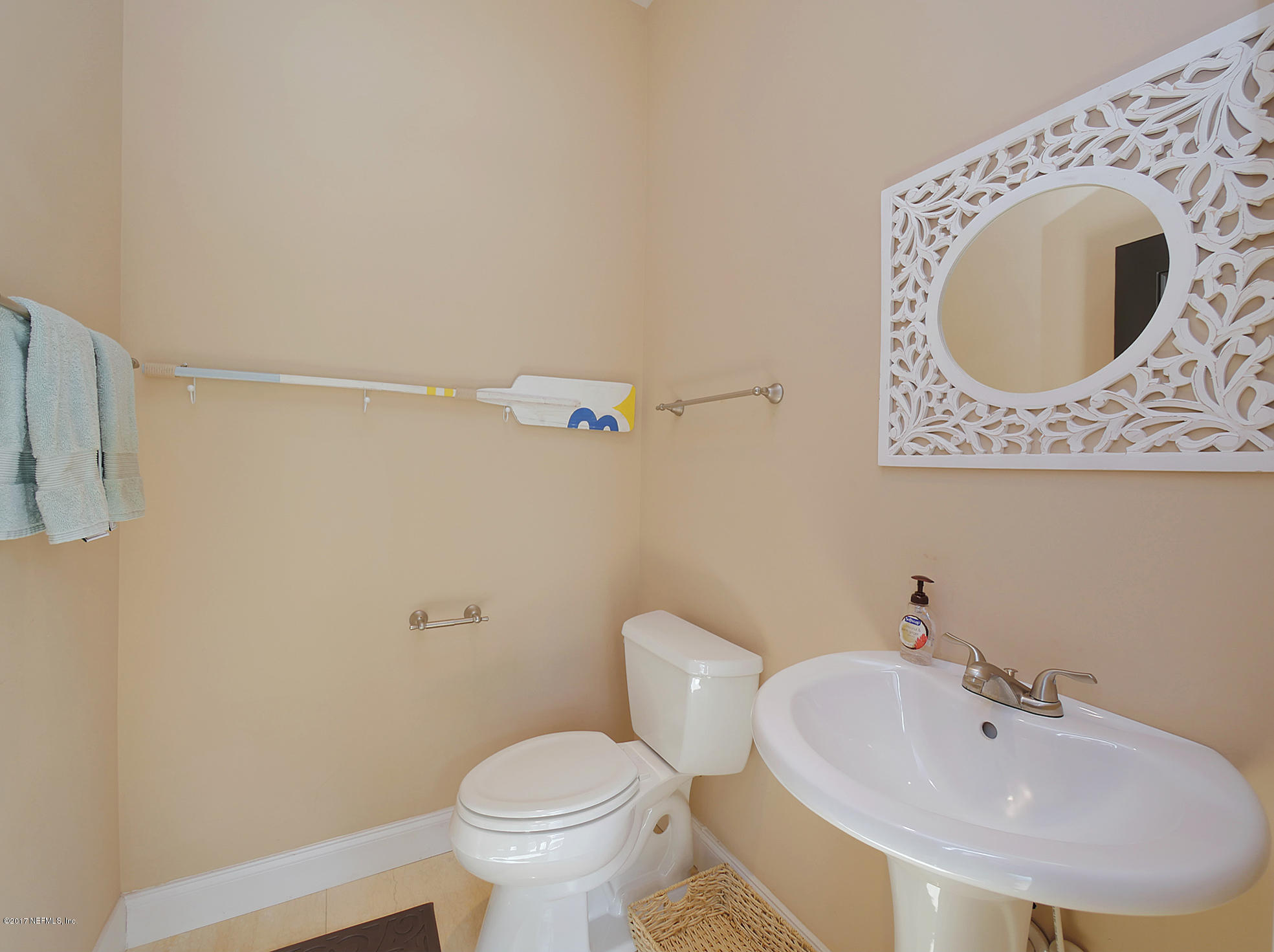 8074 Green Glade Road Jacksonville, FL 32256 - Photo 61 of 71 a bathroom with a sink mirror and toilet