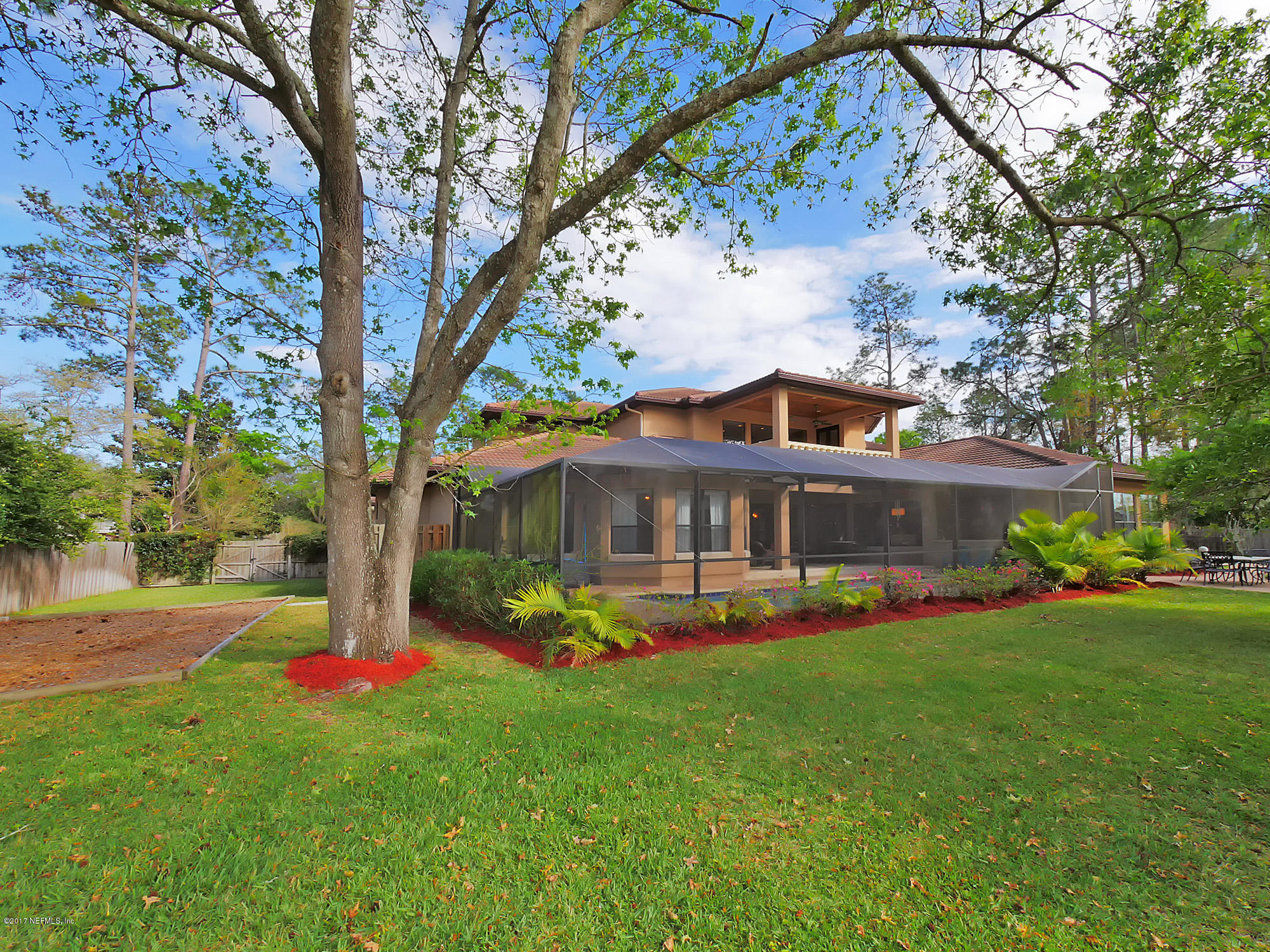 8074 Green Glade Road Jacksonville, FL 32256 - Photo 63 of 71 a front view of a house with garden