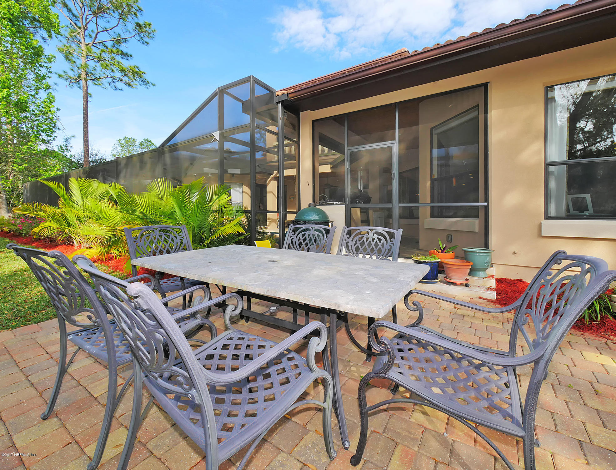8074 Green Glade Road Jacksonville, FL 32256 - Photo 65 of 71 a backyard of a house with table and chairs