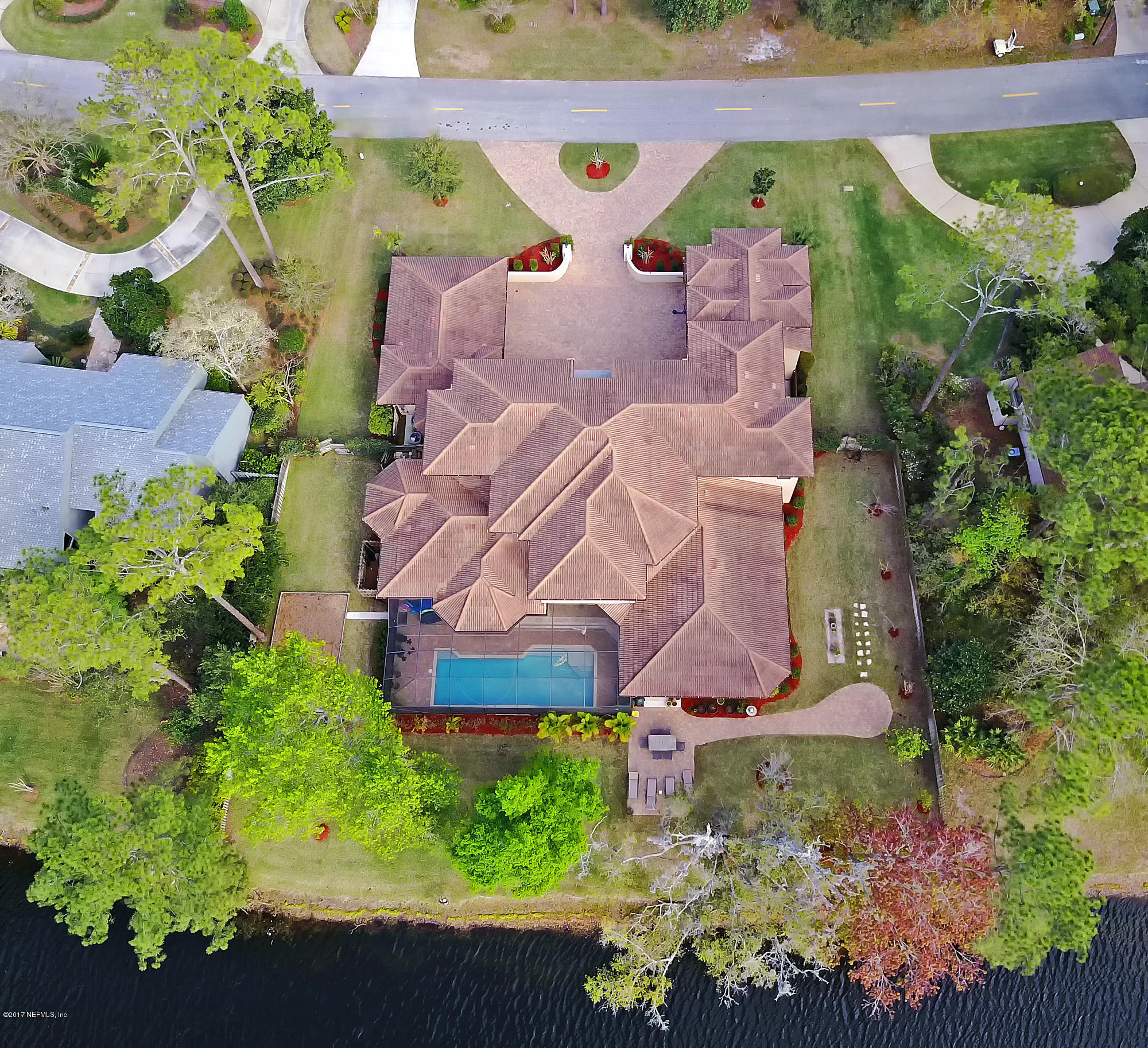 8074 Green Glade Road Jacksonville, FL 32256 - Photo 68 of 71 an aerial view of a house with a yard and garden