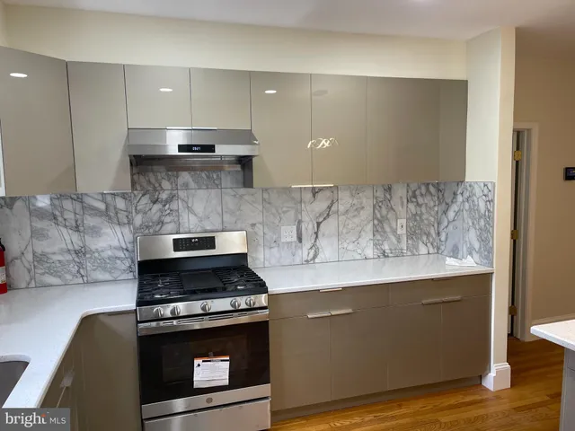a kitchen with a stove and a sink